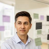 Operations Director reviewing a workflow board in a bright Singapore office